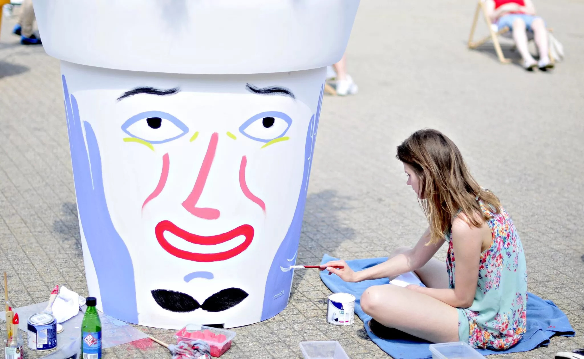 Artists painting Gianto pots